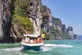 Boat near entrance to a lagoon in tropical Koh Hong island is famous tour in Andaman sea