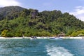 Boats and catamarans near entrance to a lagoon in tropical Koh Hong island