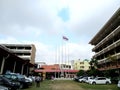 Thailand flag blowing on pole on parking yard at school