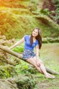 Asian girl sit down path in Bamboo forest Royalty Free Stock Photo
