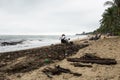 Thailand. Gulf of Thailand. Samui island. After the storm, people scavenge. Trash on the beach after a storm at sea