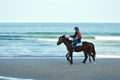 Horseback riding along the seashore. Horseback riding on the coast