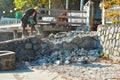 Thailand. Hua hin. January 2020. Repair work on beach. Worker with a jackhammer. Device is hollow stone. Jackhammer for rock.