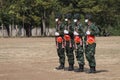 Thailand, 11 Jan 2022, a group of male soldiers wearing masks, stand in line for military training outdoors in the morning.