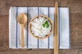 White rice, cooked white rice, cooked plain rice in wooden bowl with spoon and chopsticks, Organic rice on the rustic wooden Royalty Free Stock Photo