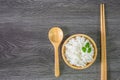 White rice, cooked white rice, cooked plain rice in wooden bowl with spoon and chopsticks, Organic rice on the rustic wooden Royalty Free Stock Photo