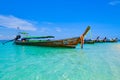 Landscape with long tail boats on tropical beach of island Krabi