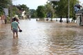 Thailand Monsoon People walking through flooded Royalty Free Stock Photo