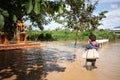 Thailand Monsoon Woman pay respect image of Buddha Royalty Free Stock Photo