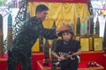 Family and children enjoy fun with military tanks guns and canon army weapons show Royalty Free Stock Photo