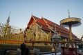 Golden Cathedrals in Haripunchai Pagoda, the famous destination and tourist attraction in the North of Thailand with golden hour s