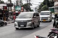 Silver car model Toyota Alphard VAN body on the street