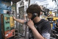 Thailand, Phuket, April 15, 2020: guy talking on a street payphone, Thai street vibe on Bangla road, real life