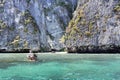 Thai traditional wooden longtail boat and beautiful sand beach at Koh Phi Phi island in Krabi