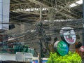 THAILAND, PHUKET - MARCH 26, 2012: Chaos of cables and wires on an electric pole. Wire and cable clutter