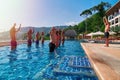 THAILAND, PHUKET, MARCH 23, 2018 - concept Healthy lifestyle. Young mans and girls engaged in crossfit with coach in outdoor pool.