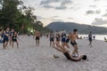 Thailand, Phuket, March 30, 2020: men and teenage girls play soccer and Rugby with a ball on the beach. sharp fight and duels, a Royalty Free Stock Photo