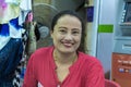 Thailand, Phuket, March 30, 2020: a pleasant good-natured Woman adult smiles, portrait of a saleswoman tourist vouchers