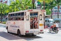 THAILAND, PHUKET, MARCH 22, 2018 - Popular public transport in Asia Tuktuk with passengers on the streets, cheap taxi