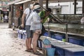 Thailand, Phuket, March 30, 2020: the seller sells live crayfish and lobsters to tourists. The fish market