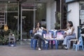 Thailand, Phuket, March 30, 2020: Thai massage salon. masseuses are bored sitting on a chair without work. The economic crisis and Royalty Free Stock Photo