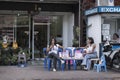 Thailand, Phuket, March 30, 2020: Thai masseuses sit without work and clients near a massage parlor. the tourism sector Royalty Free Stock Photo