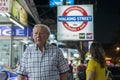 Thailand, Phuket, Patong, February 1, 2020: gray-haired elderly European man, tourist, walking Bangla road. blurr soft