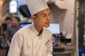 Thailand, Phuket, Patong. January 3, 2020: a young sushi bar chef attentively listens to the client and the visitor, accepts the