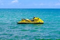 Thailand. Phuket. 08/05/18 - yellow jet ski on blue sea surface Royalty Free Stock Photo