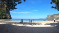 Thailand, Railay - February 2019: Timelapse. The high tide, a lot of tourists and transport wooden long-tailed boats on the tropi