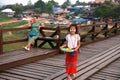 The girl sell her make up powder at the long wood bridge