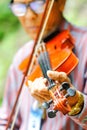 Thailand - September 10, 2017 An old man playing violin at the p Royalty Free Stock Photo