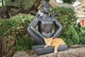 Thailand Siamese Cat Sleeping Nearby a Buddha Statue Royalty Free Stock Photo