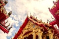 Thailand temple on a cloudy sky with the sun. Royalty Free Stock Photo