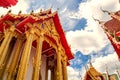 Thailand temple on a cloudy sky with the sun. Royalty Free Stock Photo