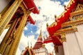 Thailand temple on a cloudy sky with the sun. Royalty Free Stock Photo