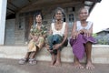 Thailand with three woman in front of there houses