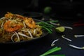 Thailand traditional cuisine, Pad thai, dried noodle, fried noodles, shrimp and seafood, street food, dark food photography Royalty Free Stock Photo