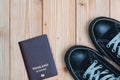 Thailand traveler's Passport and sneakers ready to travel on woo