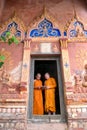 Thailand Two novices are standing reading books together in the Royalty Free Stock Photo