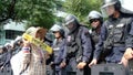 Thailand: A woman with talking to some Thai Riot police .