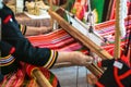 Thailander Hill tribe ladies are demonstration of weaving colorful fabric for tourists in her village Royalty Free Stock Photo