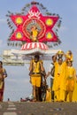 Devotee carry kavadee on the road during Thaipusam