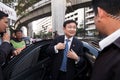 Thaksin Shinawatra gets off a car. Royalty Free Stock Photo