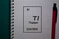 Thallium - TI. write on a book isolated on Office Desk