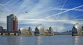 Thames Barrier in London, with PLANE TRACKS AND PLANE Royalty Free Stock Photo