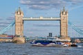 Thames Clipper catamaran next to the Tower Bridge on the river Thames in London