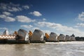 Thames flood barrier with blue sky and white clouds