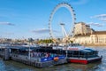 Thames river boats terminal at Westminster Bridge with a view of the London Eye Royalty Free Stock Photo