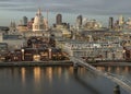 Thames River, With St. Paul\'s Cathedral Rising Above All the Other Buildings with Millennium Bridge at dusk Royalty Free Stock Photo